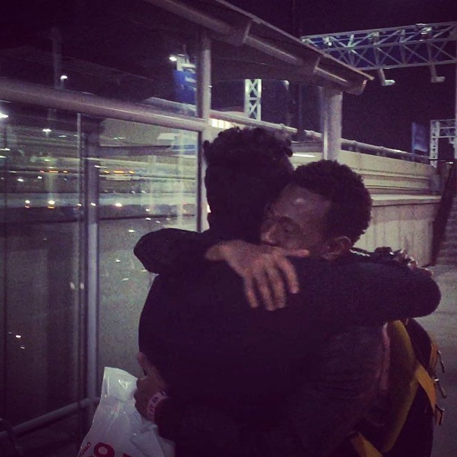 Saadiq and Sa'ad reunite at the Lambert-St. Louis International Airport after being separated for two years. Courtesy of J.R. Biersmith
