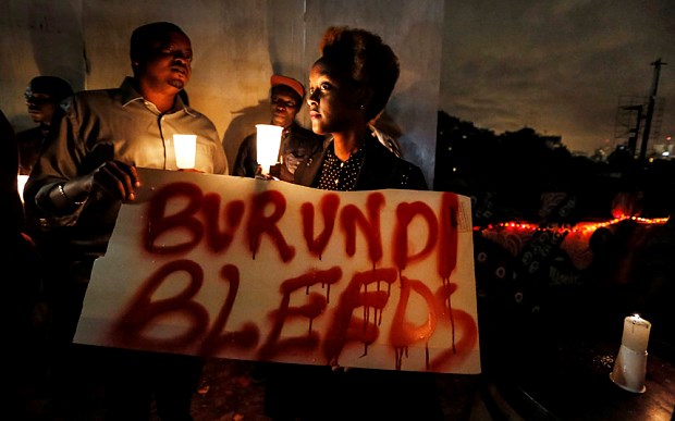 A Burundian expatriate attends a candlelight vigil held for Burundi in Nairobi, Kenya Photo: EPA