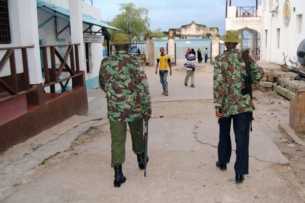 Kenyan police walk through Lamu Town. Learning is yet to resume at Mangai, Basuba, Milimani and Mararani primary schools. PHOTO | PAIGE AARHUS NATION MEDIA GROUP