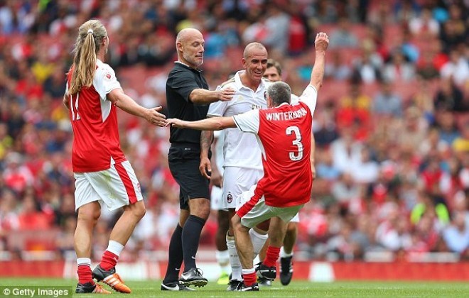 Nigel Winterburn falls back jokingly mocking the shoving incident with Paolo Di Canio