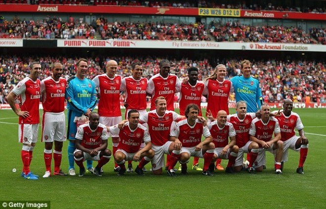 The Arsenal legends line up for a team photo before their game at the Emirates Stadium