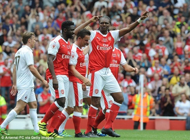 Kanu rolls back the years with the opening goal of the game and is mobbed by his team-mates