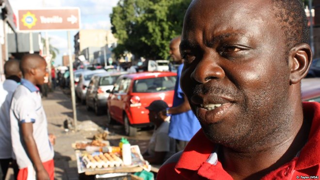 DRC soccer supporter Freddy Lendo in Rockey Street, Johannesburg, an epicenter of South Africa's large African immigrant community.