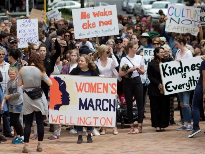 Participants of a rally regarding women's rights hold placards as they march in Wellington, New Zealand, January 21, 2017 the day after Donald Trump's inauguration as President of the United States./ REUTERS