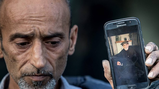 Omar Nabi holds a photo of his father, 71-year-old Haji Daoud Nabi, who was killed in the attack at Masjid An-Nur in Christchurch.JASON SOUTH/THE AGE