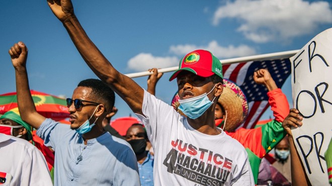 Members of the Oromo community march in St. Paul, Minnesota in protest following the death of musician and revolutionary Hachalu Hundessa [Brandon Bell/Getty Images/AFP]