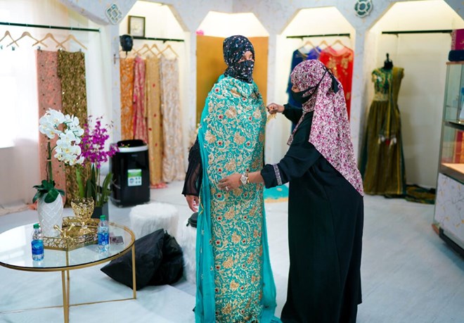 Sabrina Seyf, owner of Sabrina's Bridal, worked with a bride-to-be in her store at Karmel Mall in Minneapolis.GLEN STUBBE - STAR TRIBUNE