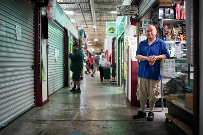 Xue Lor has always relied on foot traffic to bring business to his electronics repair shop, Lor Imports & Custom PC, in Hmong Village in St. Paul. Yet that slowed when nearby food vendors closed during the state-ordered shutdown.GLEN STUBBE, STAR TRIBUNE