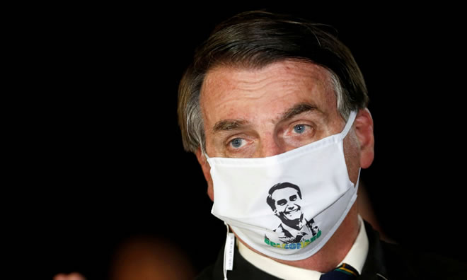 Bolsonaro in late May. The president has flouted social distancing and attended events and political rallies.
Photograph: Adriano Machado/Reuters