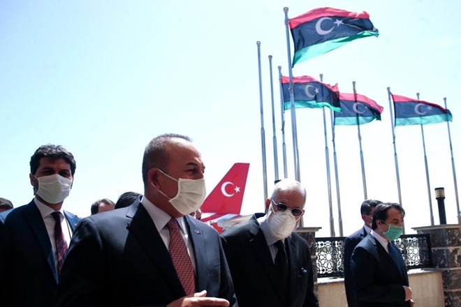In this June 17, 2020, file photo, Turkey's Foreign Minister Mevlut Cavusoglu, left, and Muhammed Tahir Siyala, Foreign Minister of Libya's internationally-recognized government, speak at the airport, in Tripoli, Libya. Libya’s eastern-based forces have lost the chance to engage in a political solution to the North African country’s conflict, Turkey's foreign minister said Saturday, June 20, 2020. (Fatih Aktas/Turkish Foreign Ministry via AP, Pool, File)
