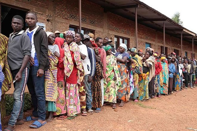 Burundians wait in a line to vote during the general elections at a polling station in Bubu Primary School in Giheta, central Burundi, on May 20, 2020. PHOTO | AFP