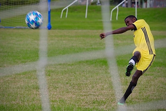 Future Stars United striker attempts a game-winning shot in the Ramadan Cup quarter-finals. (ABC News: Lucas Hill)
