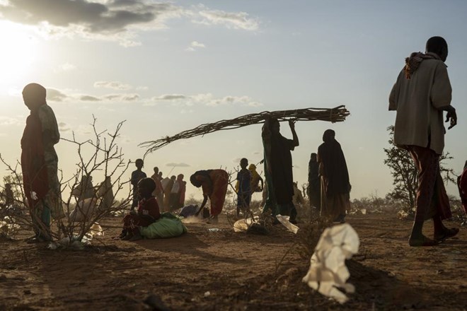 Somalis who have been displaced settle at a camp on the outskirts of Dollow, Somalia Tuesday, Sept. 19, 2022. Somalia has long known droughts, but the climate shocks are now coming more frequently, leaving less room to recover and prepare for the next. (AP Photo/Jerome Delay)