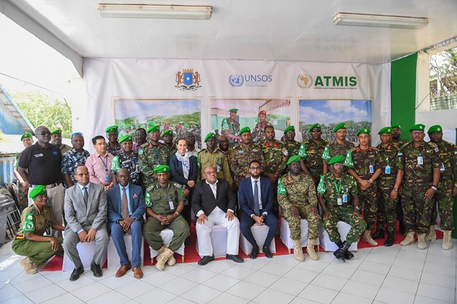The Special Representative of the Chairperson of the African Union Commission (SRCC) for Somalia, Ambassador Mohammed El-Amine Souef, Somalia's State Minister of Defense Abdinur Dahir Fidow, senior officials from ATMIS, FGS and the UN pose for a group photo during the official handover of Maslah Forward Operating Base (FOB) in Mogadishu, Somalia, on 21 January 2023. ATMIS Photo / Mukhtar Nuur