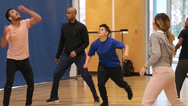 Immigration minister meets with youth group, plays soccer