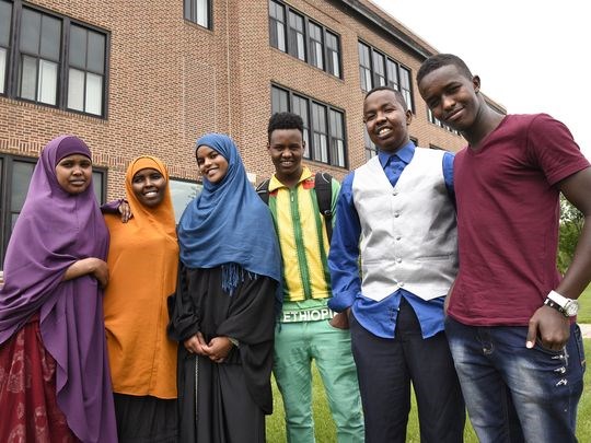 Somali students stand in front of their school following a group meeting of Somali students on May 28 at Tech High School. Students helped craft solutions to issues raised in a protest earlier in the 2014-15 school year. Somali students stand in front of their school following a group meeting of Somali students Thursday, May 28, at Tech High School. (Photo: Dave Schwarz, dschwarz@stcloudti)