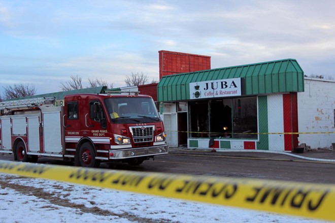 Juba Coffee House, a popular Somali restaurant in Grand Forks, caught fire early Tuesday, leaving the building badly damaged. Fire crews and police detectives remained at the restaurant late into the afternoon investigating the fire and examining the building. Grand Forks Herald photo by Lori Weber Menke