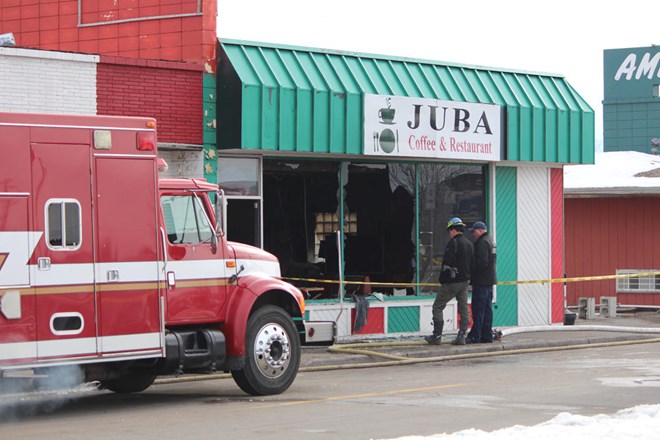 Investigators could be seen taking pictures of the site and digging through debris at Juba Coffee House, where a fire broke out in the early hours of Tuesday morning. Grand Forks Herald photo by Sarah Volpenhein.
