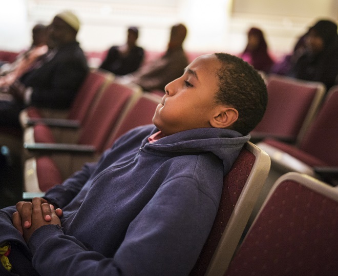 Hamza Mohamud,13, listened intently to speakers at the town hall meeting. Minnesota, with the largest Somali community in the nation, is a major source of recruits to terror groups.