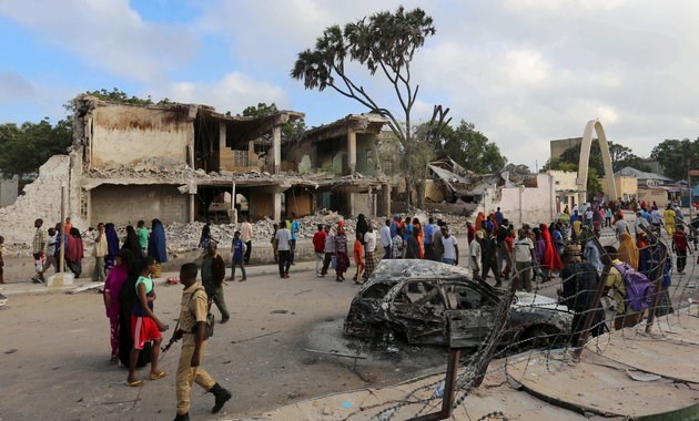 Residents view the damage after a car bombing at a hotel in Mogadishu in February 2016. Al Shabab has stepped up attacks in recent months and recaptured cities in southern Somalia. FEISAL OMAR/REUTERS