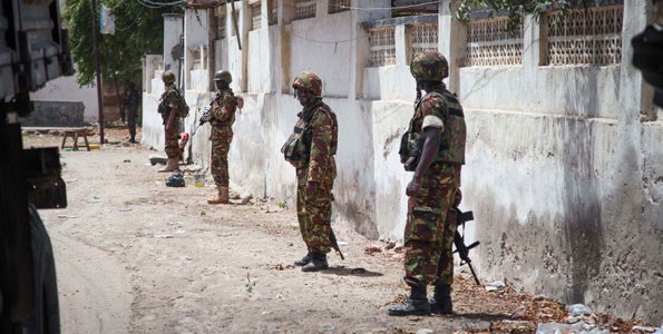 Kenyan soldiers serving with the African Union Mission in Somalia (Amisom) on patrol in Kismayu, Somalia. The mission's top leadership says that some of its programmes have stalled due to lack of funding. FILE PHOTO | AFP