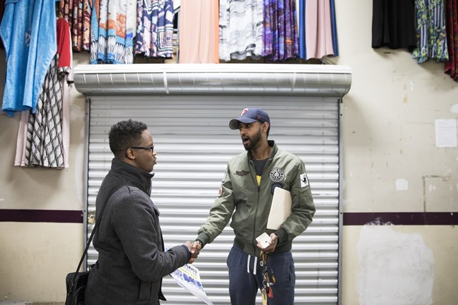 Khalid Mohamed, left, talks to Guled Hassan about supporting Dine Out for Somalia while at Village Market.