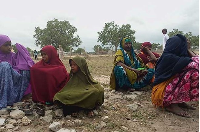 Women and children await treatment from KDF personnel at Kotile Dispensary as they receive. PHOTO | KALUME KAZUNGU | NATION MEDIA GROUP
