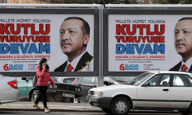 The face of Turkish President Recep Tayyip Erdogan on a billboard in Ankara. Photo: AFP/Adem Altan