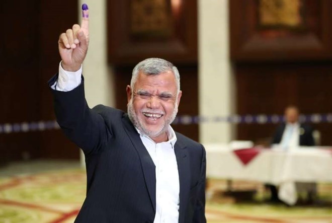 Leader of the Al-Fatih bloc Hadi al-Amiri shows his ink-stained finger after casting his vote in Baghdad last Saturday. (Ahmed Jadallah/Reuters)